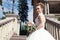 Young bride in a white dress with a beautiful wedding bouquet on