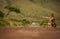 Young bride in white wedding dress on background of beautiful view of Flores island, AzoresYoung woman hitching a ride on a road i