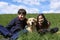 young brothers with their Labrador Retriever dog on a sunny day