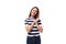 young brunette female model dressed in a striped t-shirt and jeans is experiencing joy and happiness