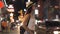 Young brunette female solo traveler walking on city street in evening night in summer clothes