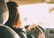 Young brunette long hair woman driving passenger car