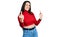 Young brunette teenager wearing red turtleneck sweater showing middle finger doing fuck you bad expression, provocation and rude
