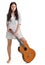 Young brunette in white chemise with guitar