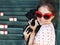 Young brunette woman hugging her lap dog puppy