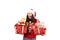 Young brunette woman with long curly hair wearing santa claus hat andd holding presents