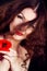 Young brunette woman and poppies