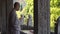 Young buddhist monk praying with closed eyes in buddhist monastery