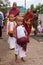 Young buddhist novices and monks collecting everyday alms near the Kyaiktiyo pagoda or Golden rock, Myanmar.