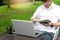 Young buseness man work on the table with his laptop