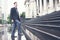 Young business man climbing steps on way to work horizontal