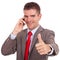Young business man on phone ok gesture