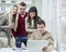 Young business people looking at laptop in meeting