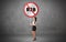 Young business person holdig traffic sign