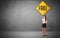 Young business person holding road sign