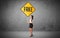 Young business person holding road sign