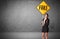 Young business person holding road sign