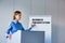 Young business speaker standing and doing business presentation in conference room