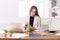 Young business woman eating salad at office