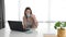 Young business woman expert for financials working in the office on laptop. Female businessperson freelancer work for new company