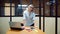 Young business woman in her office. Work in the office, a professional girl stands near the table.