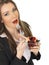 Young Business Woman Holding a Bowl of Fresh Mixed Berries Eating a Strawberry from a Fork