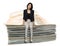 Young business woman sit on a sum of banknote .