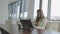 Young business woman is working on a laptop sitting at the desk in the office.