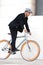 Young businessman biking to work