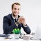 Young businessman in black confident style suit working at office