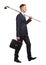 Young businessman with briefcase and rake on the white