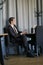 A young businessman came to lunch in a cafe, he sits at a table and waits someone