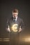 Young businessman chooses a Gold Euro Sign.