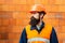 Young businessman construction site engineer, close up. Caucasian young builder standing. Worker portrait. Bearded