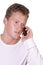 Young businessman conversing on cell phone