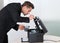 Young businessman fixing cartridge in photocopy machine