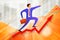 young businessman going up on growing steps Arrow and points forward in direction of movement with business statistics chart