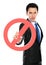 Young businessman holding prohibited sign