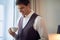 A young businessman in the hotel room enjoying start of a new working day. Hotel, business, people