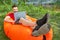 Young businessman on  inflatable sofa is working