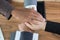 Young businessman joining hand, business team touching hands tog