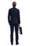 Young businessman in navy blue suit holding suitcase and looking up