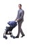 The young businessman nursing child in pram on white