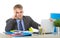 Young businessman overworked looking worried sitting at office computer desk in stress