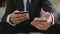 Young businessman paying with credit card on a smart phone