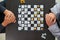 Young businessman planning winning chess move in game of chess representing successful and victorious business path. chess concept