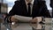 Young businessman reading terms of agreement for signing, business contract