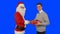 Young businessman receiving a present from Santa Claus, shaking hands, blue screen chromakey