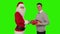 Young Businessman receiving a present from Santa Claus, shaking hands, Green Screen, stock footage