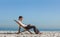 Young businessman resting on his deck chair using his tablet